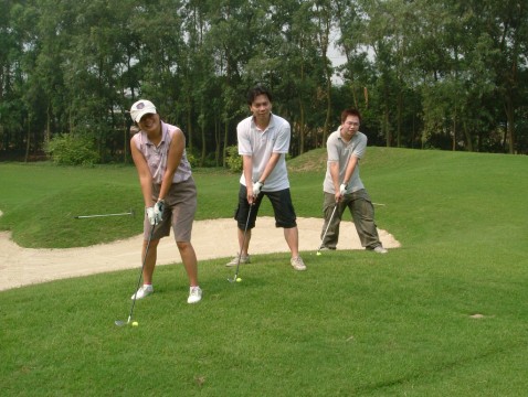 Trois joueurs de golf chinois